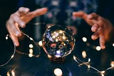 Hands over a crystal ball